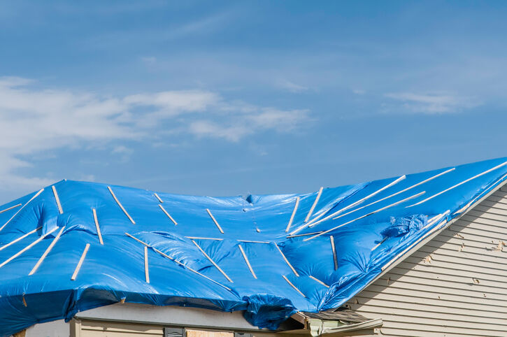 Roof tarp installation by Revildor